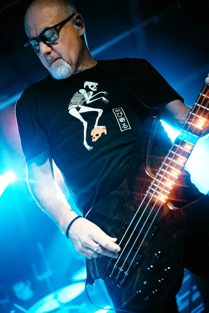 Bassist close-up with blue backlight
